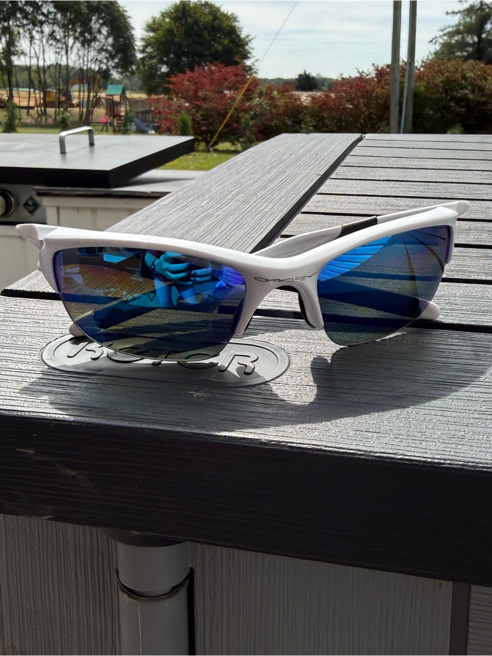 Oakley White Sunglasses with Blue Mirrored Lenses